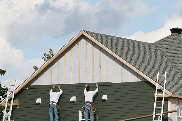 Professional Storm Damage Siding Repair technician working in Willernie, MN